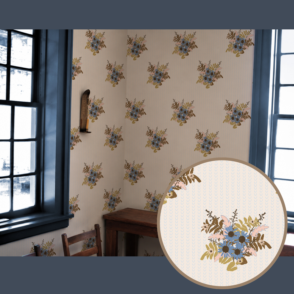 Floral wallpaper with a repeating pattern of blue and gold flowers on a cream background, shown installed on an interior wall with dark-framed windows and a wooden table. A circular inset highlights the detailed floral pattern.